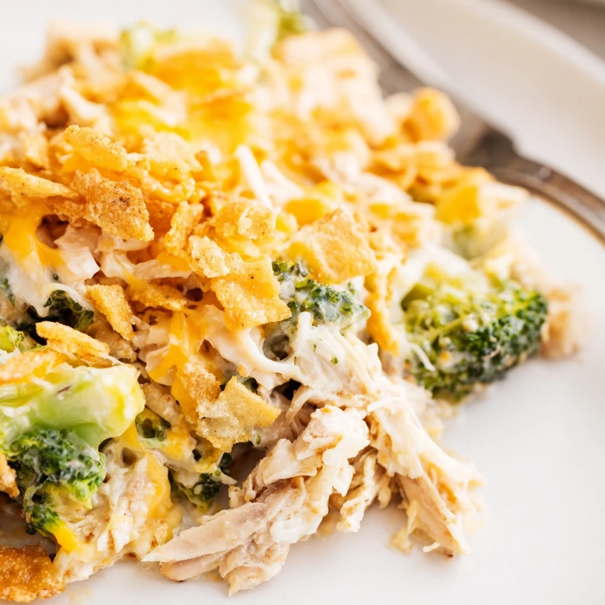 Creamy Chicken and Broccoli Casserole topped with crunchy golden crackers, perfect for family dinners.
