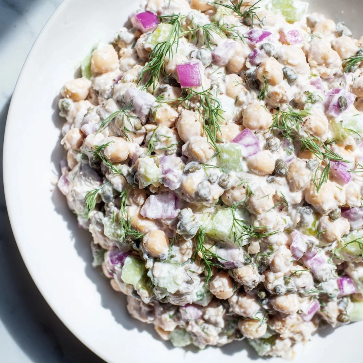 Creamy chickpea tuna salad, a vegan delight with flaked seaweed, ready for a sandwich or wrap.
