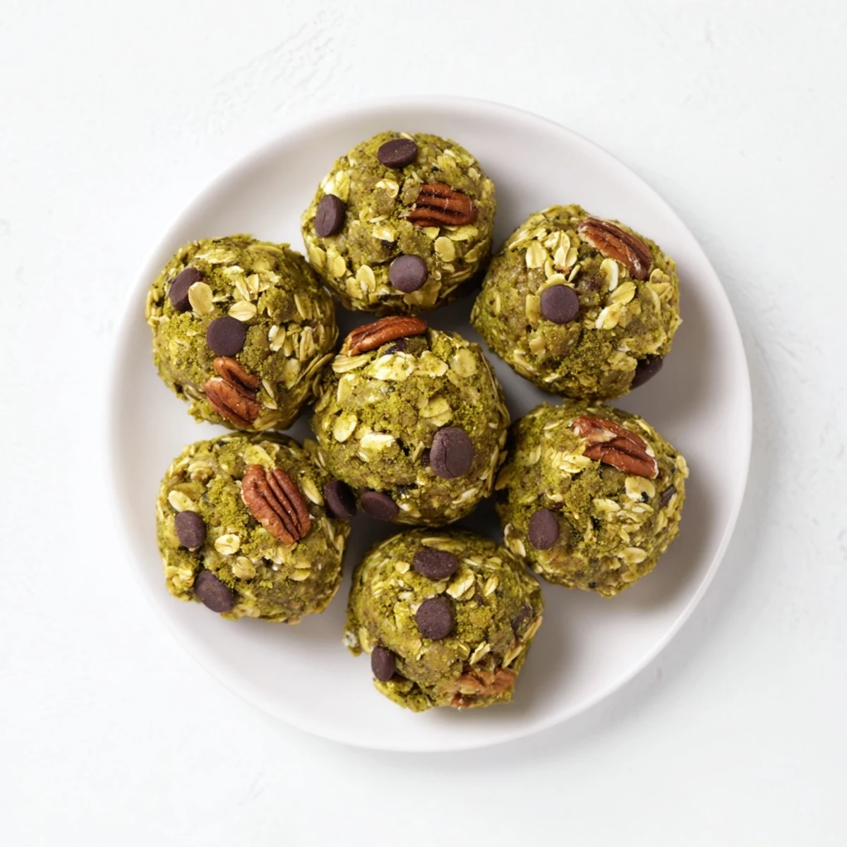 A close-up of Matcha Gingerbread Cookie Dough Protein Bites, ready to enjoy as a flavorful, healthy snack.