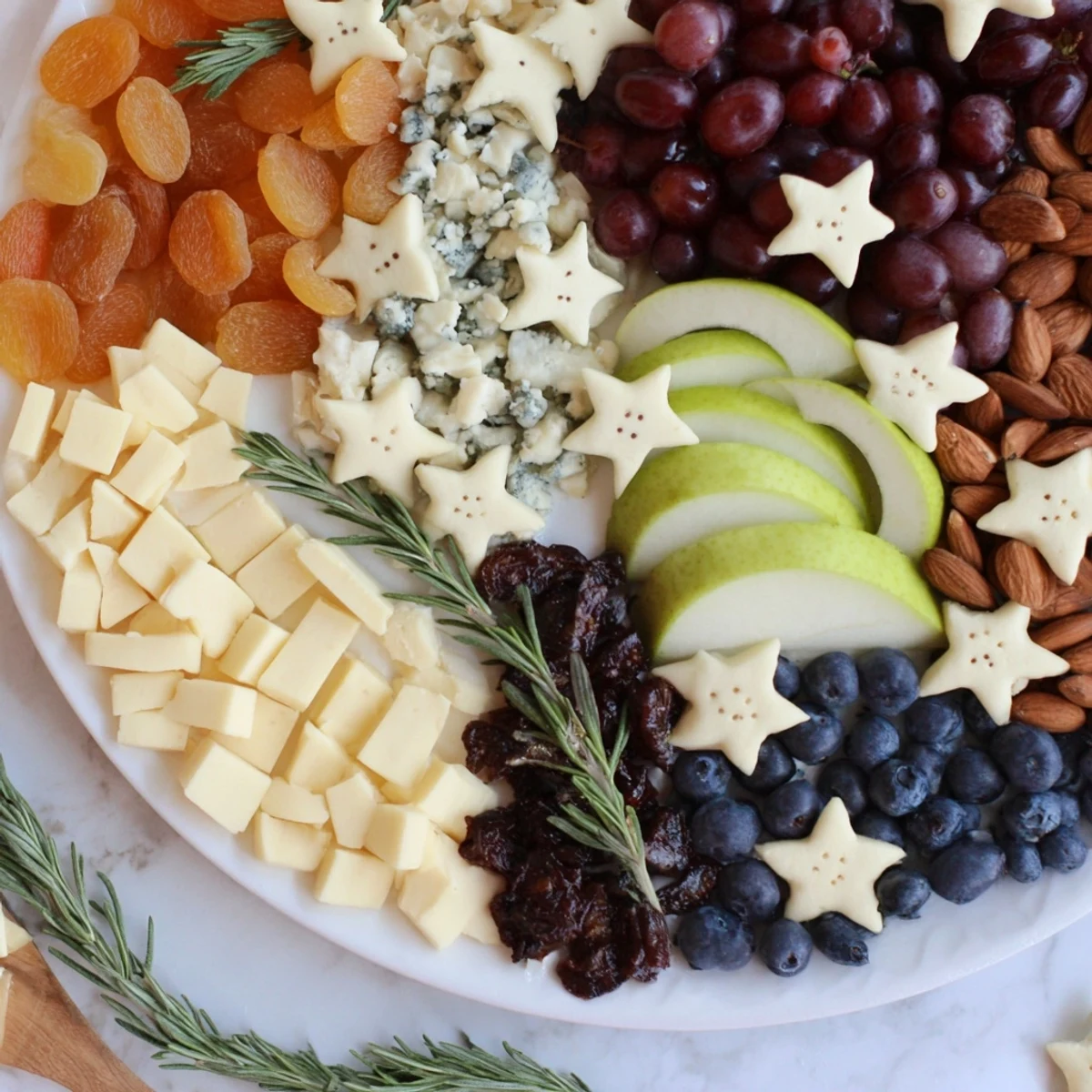 Vibrant Moon & Stars Night Board appetizer arrangement: a stunning selection of savory and sweet treats.