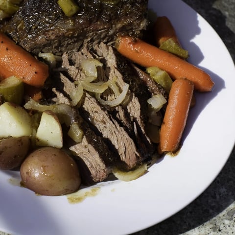 Tender Pickle Brine Pot Roast with visible vegetables, perfect for a cozy, flavorful dinner.