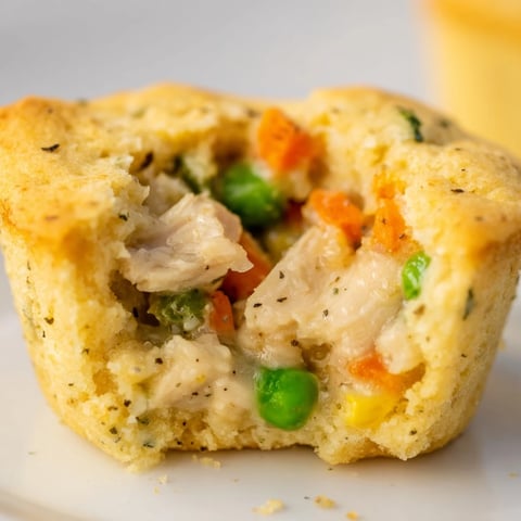 Golden-brown Chicken Pot Pie Cornbread Muffins, warm and savory, baked to perfection for a quick appetizer.