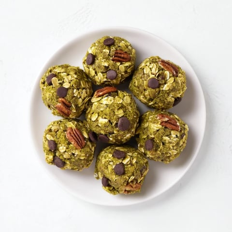 A close-up of Matcha Gingerbread Cookie Dough Protein Bites, ready to enjoy as a flavorful, healthy snack.
