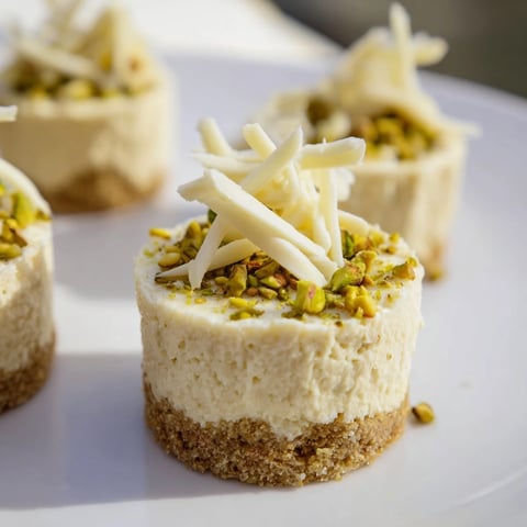 Delectable Pistachio Cheesecake Bites showcasing a vibrant green filling and crunchy pistachio crust, ready to enjoy.