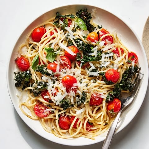 A close-up shot of the savory one-pot spaghetti, bursting with vibrant tomatoes and fresh herbs.