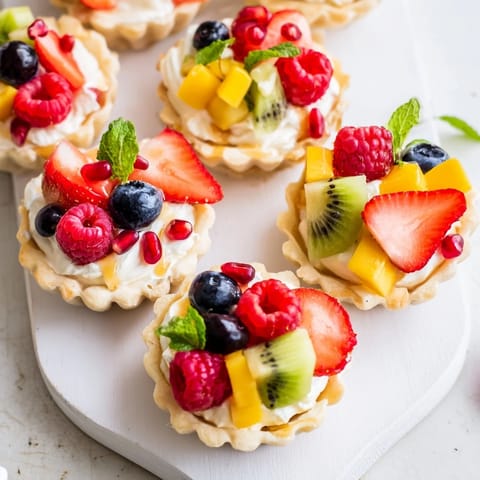 Beautiful heart shaped board displaying delicious Heart Shaped Fruit Tart, perfect for Valentine's Day.
