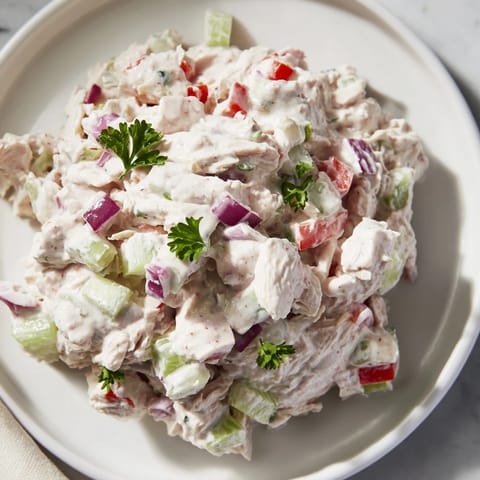 Freshly made canned chicken salad with Mrs. Dash, celery, and a tangy lemon dressing, chilled.
