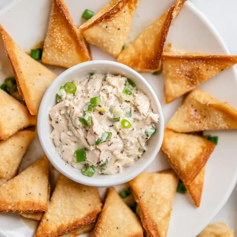 Crispy air-fried Air Fryer Lumpia Chips, a delicious appetizer with a savory chicken cream cheese dip.