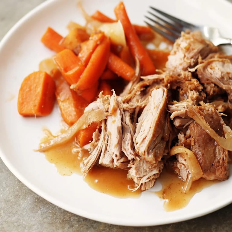 Delicious Slow Cooker Apple Cider Pork Roast with a hint of sweet cinnamon.