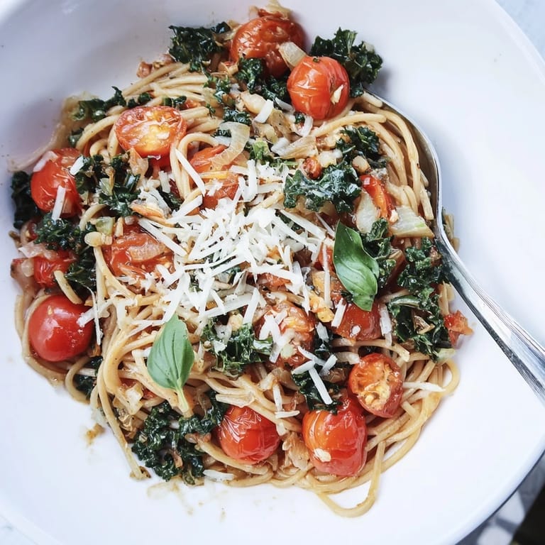 Delicious, easy one-pot spaghetti, featuring tender pasta, wilted kale, and a Parmesan sprinkle.