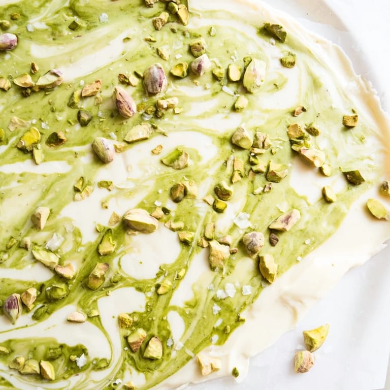 Homemade Pistachio Matcha White Chocolate, a beautiful dessert bark with a lovely, textured pistachio topping, ready to enjoy.