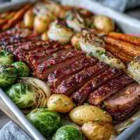 Tender corned beef and crispy cabbage roasted with golden potatoes and carrots on a sheet pan for an easy Irish-American dinner.  